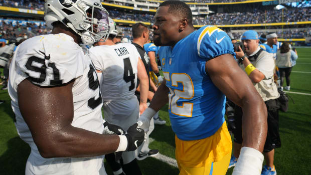 Sep 11, 2022; Inglewood, California, USA; Los Angeles Chargers linebacker Khalil Mack (52) shakes hands with Las Vegas Raiders defensive tackle Bilal Nichols (91) after a game at SoFi Stadium. Mandatory Credit: Kirby Lee-USA TODAY Sports